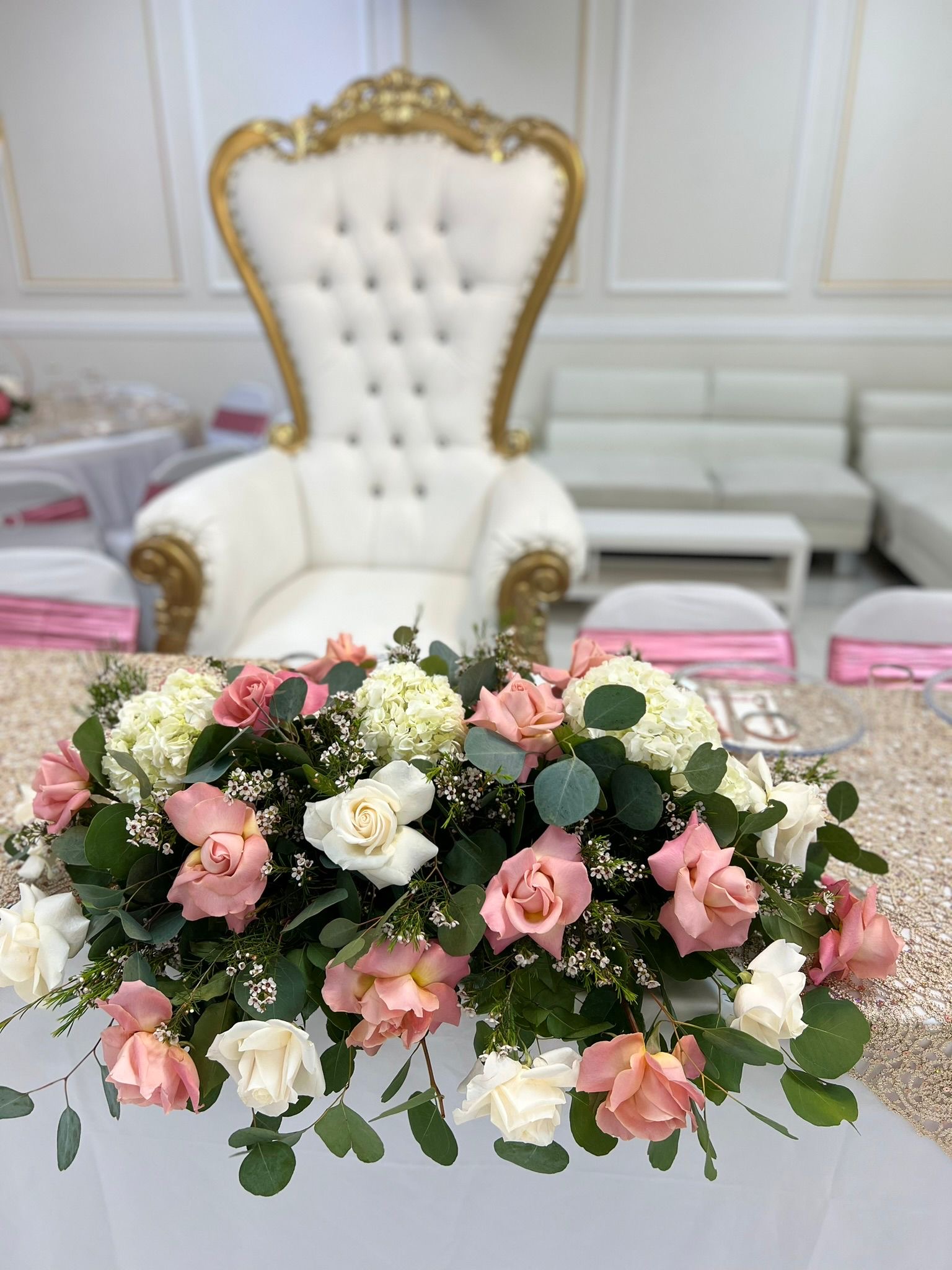 Gold throne chair with pink and white flowers